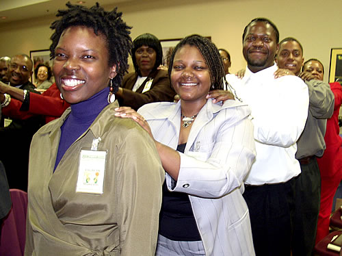 Audience participating in group massage, Los Angeles, California Black Business Seminar