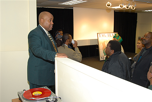 Delxino explaining the many uses of the TAG TEAM Presentation Room, TAG TEAM Marketing Atlanta Facility Grand Opening