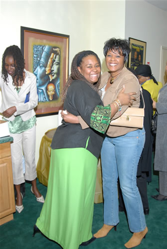 Sisters posing for a picture, TAG TEAM Marketing Atlanta Facility Grand Opening