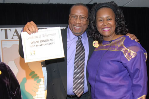 David poses with Debbie after receiving certificate on stage, 2007 TAG Awards Show